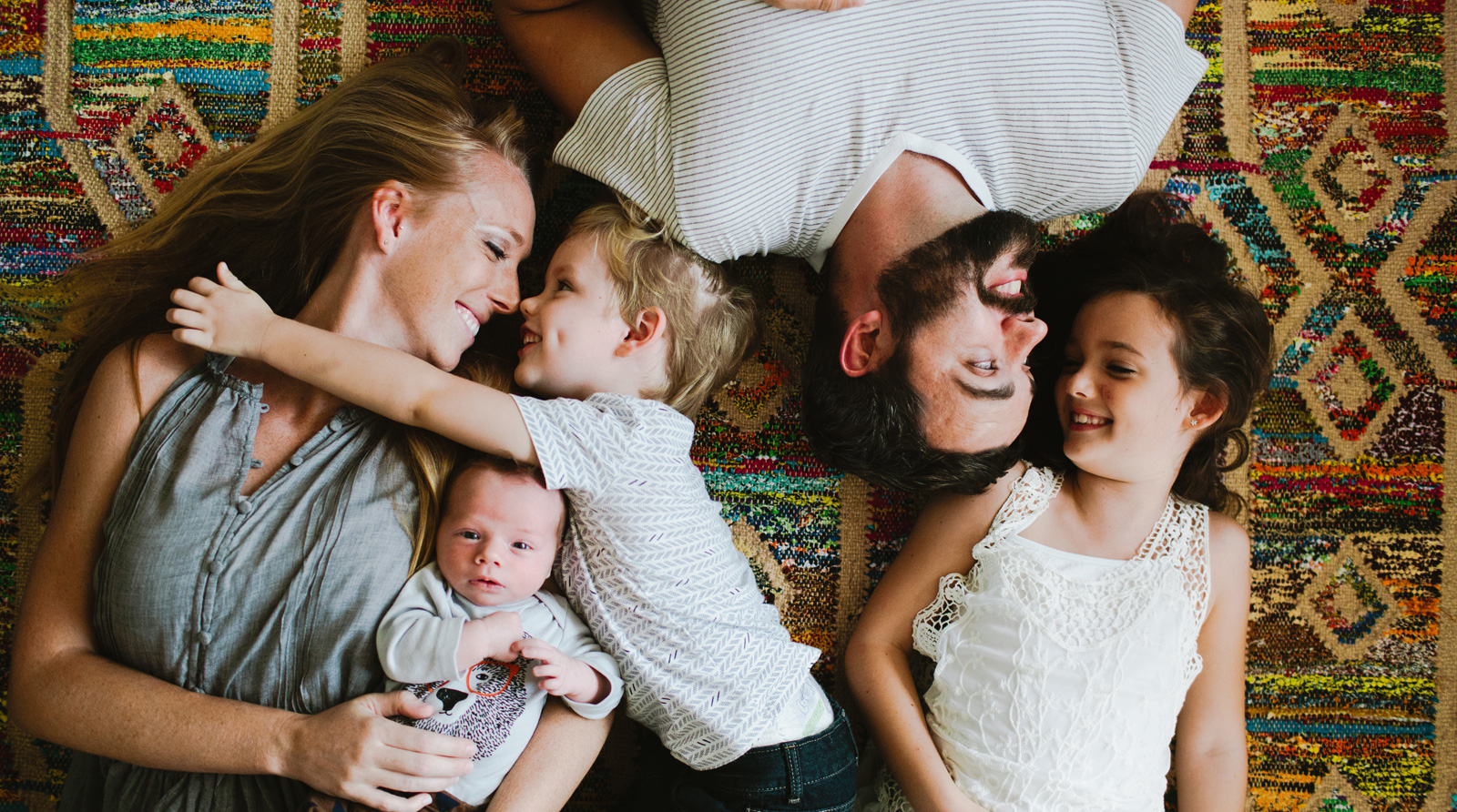 Family laying together as part of the MyPoint Campaign